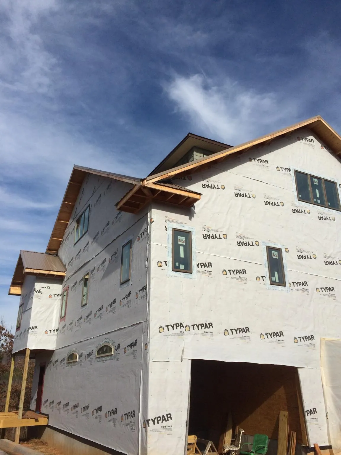Stick built house wrapped in Typar with new roof framing and dormers in Evangeline